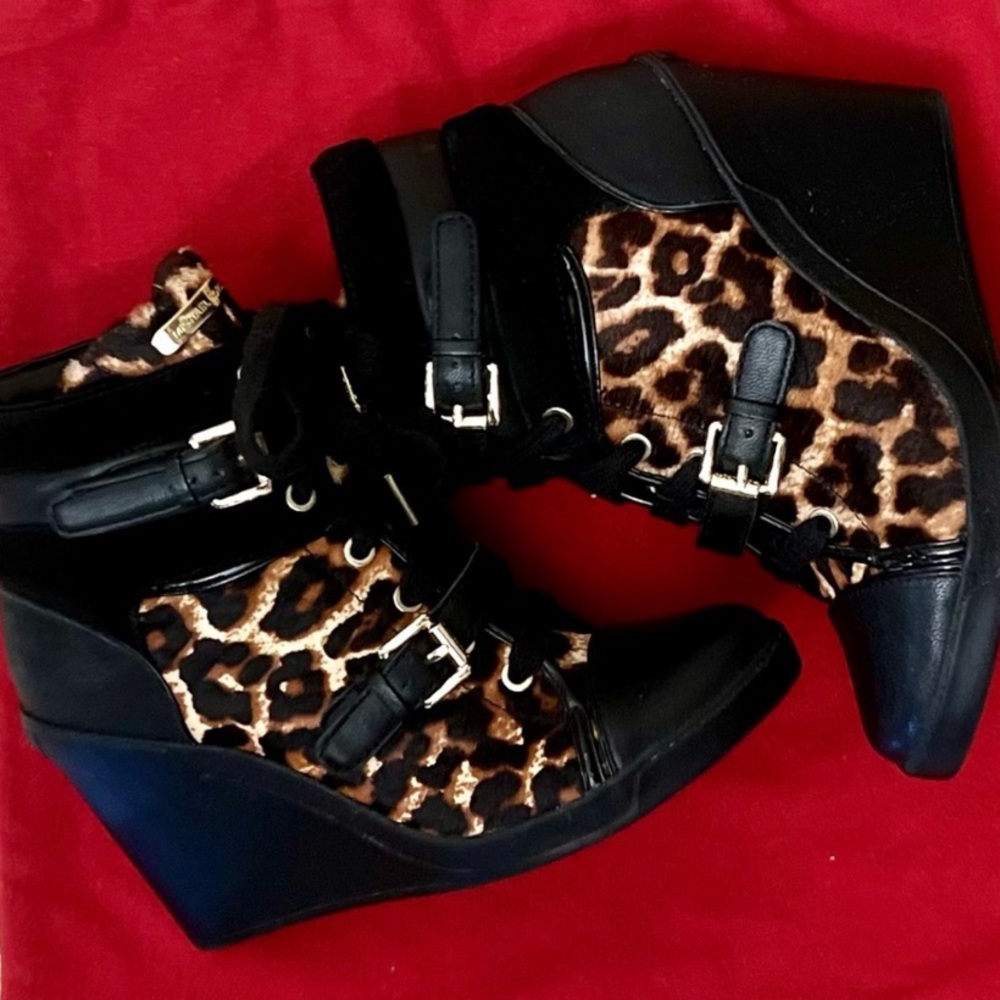 - Michael Kors “Skid” wedge sneakers